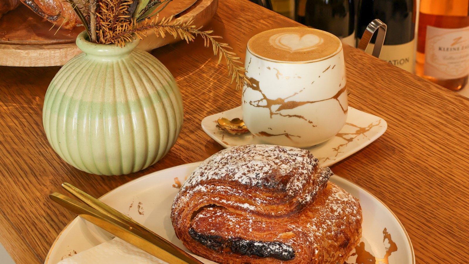 A flat white and a pastry on a table at the Dixie Jane café in De Waterkant